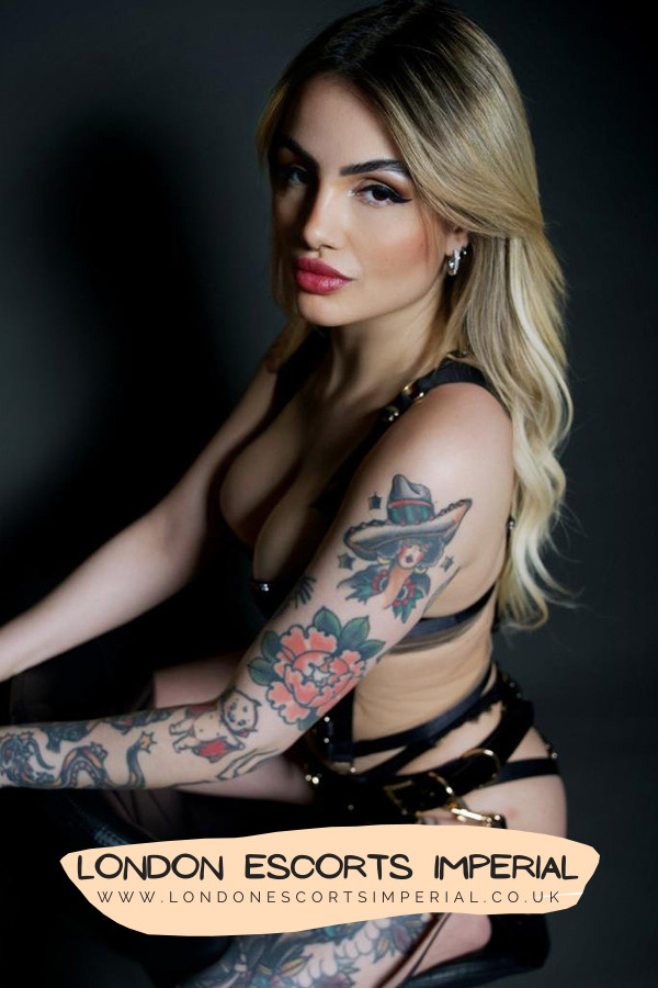 London Escort Girl Colourful Tattooed 34B